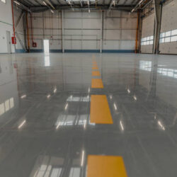 Epoxy and waxed flooring with colorful signage in car service